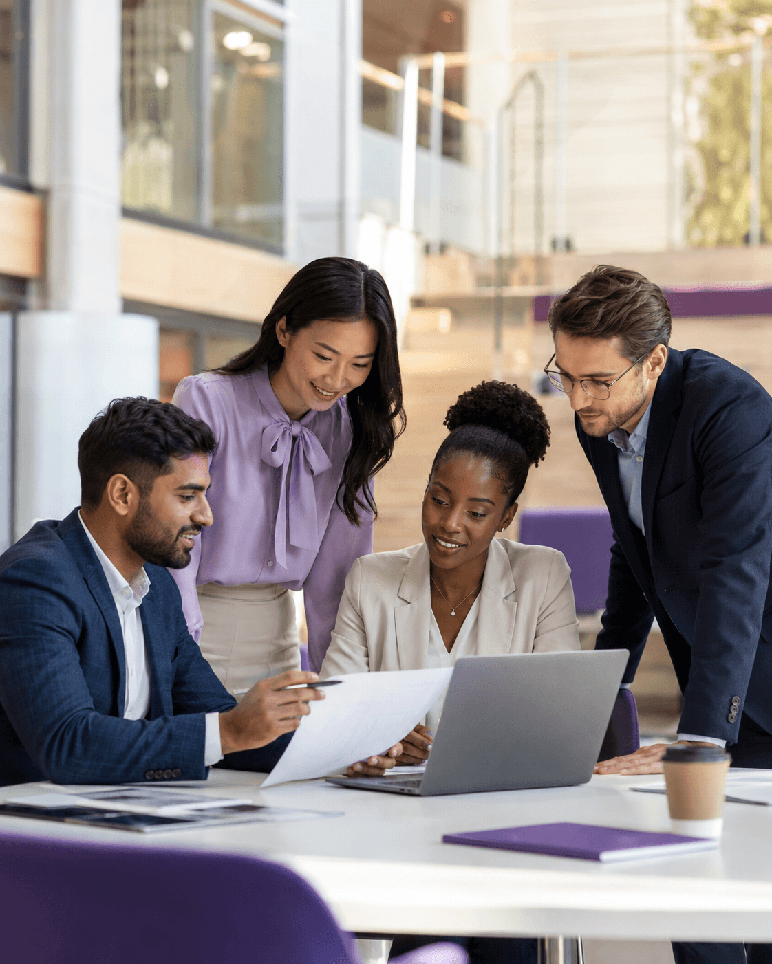 A diverse group of business professionals collaborating during a meeting